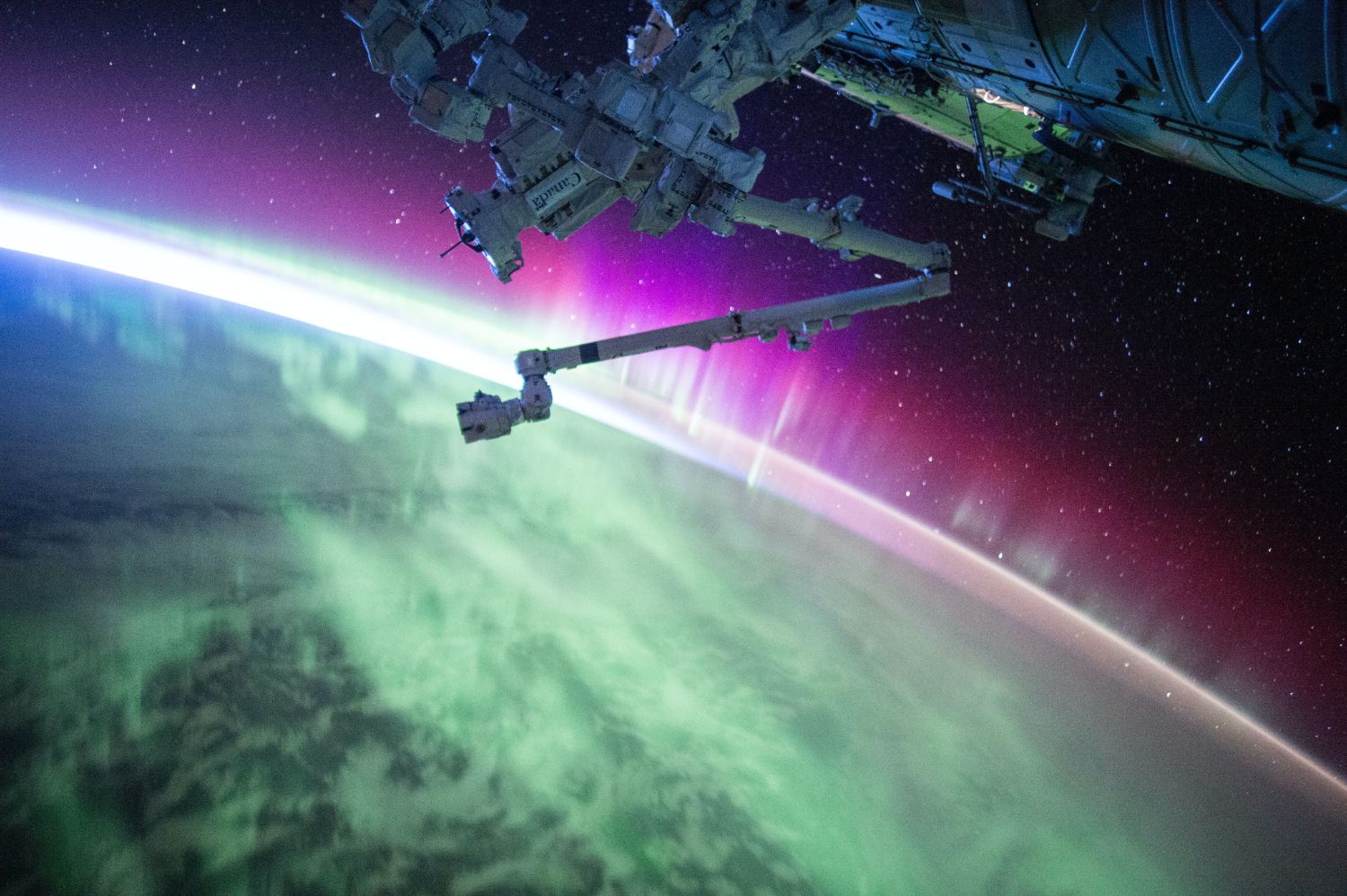 Systems engineering - NASA image of satellite with aurora borealis from space